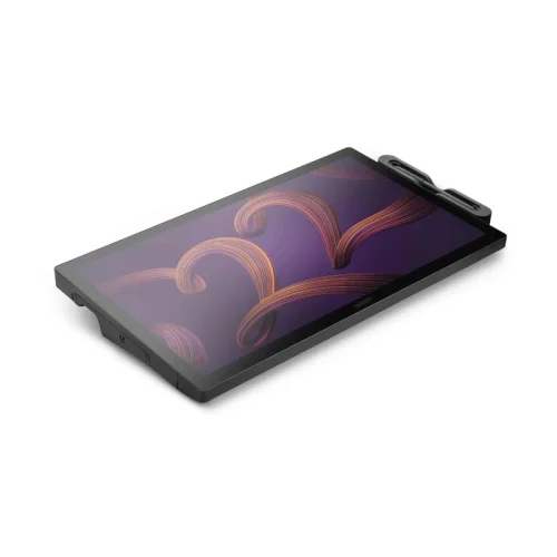 Tablet graficzny z ekranem Wacom Cintiq Pro 22 leży płasko i prezentuje nowoczesny design. Minimalistyczna konstrukcja zapewnia wygodę oraz dużą przestrzeń roboczą.